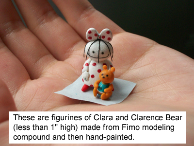 Miniature figurines of Clara and Clarence Bear in Lauren's hand